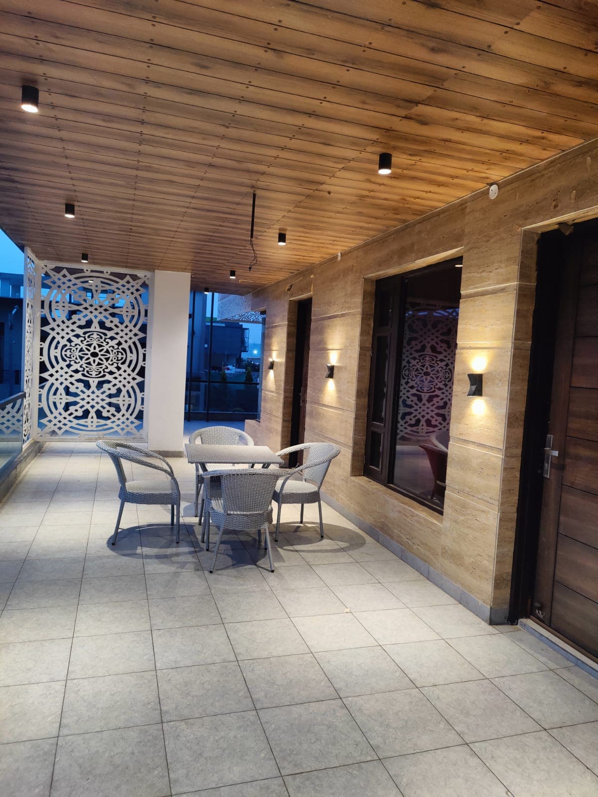 Terrace seating lit up in the evening at Jastej House homestay