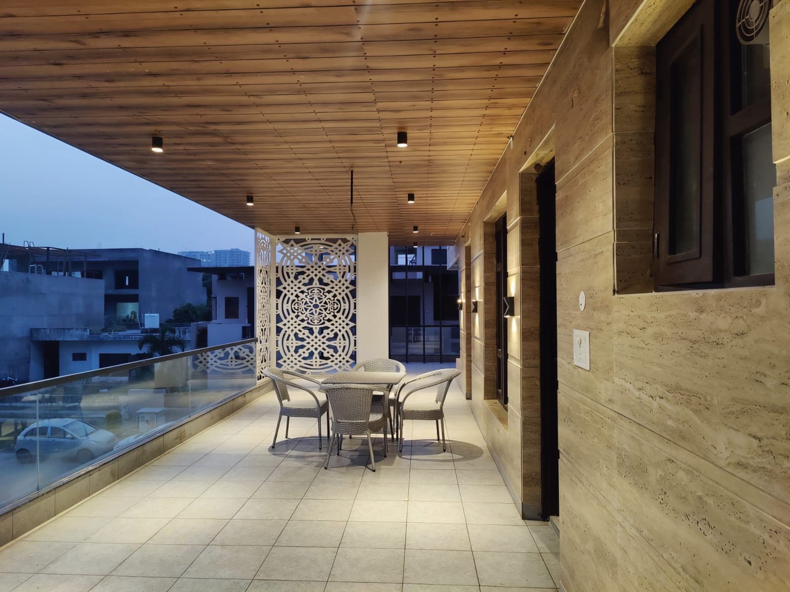 Covered terrace with outdoor seating at Jastej House, Aerocity Mohali